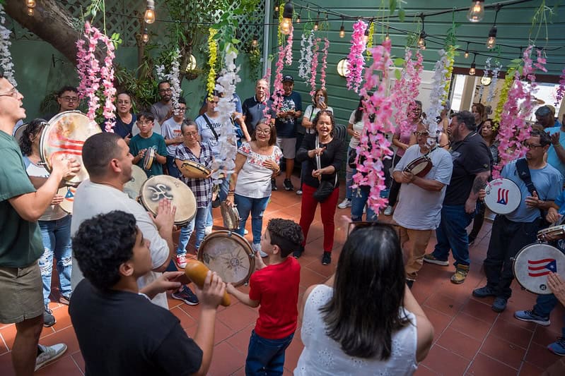 A group of people at an event playing instruments